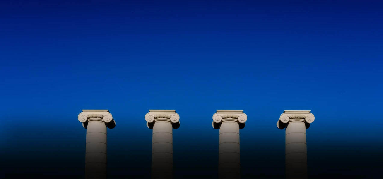 Four pillars with blue sky behind